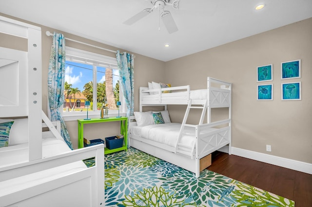 bedroom with recessed lighting, wood finished floors, a ceiling fan, and baseboards