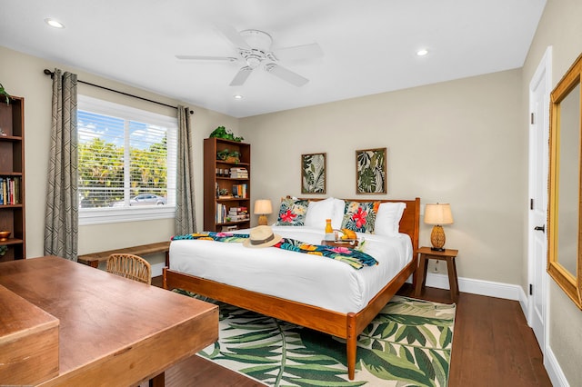 bedroom with recessed lighting, a spacious closet, wood finished floors, visible vents, and ensuite bathroom