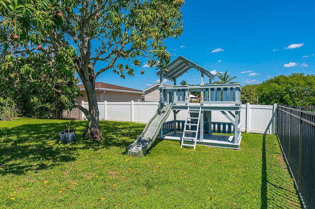 back of property with a lawn, an outdoor pool, a patio area, and stucco siding