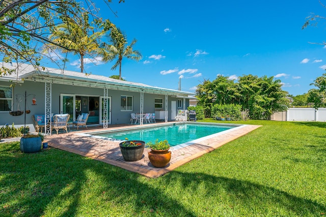 view of pool featuring a fenced in pool, a lawn, a patio, and fence