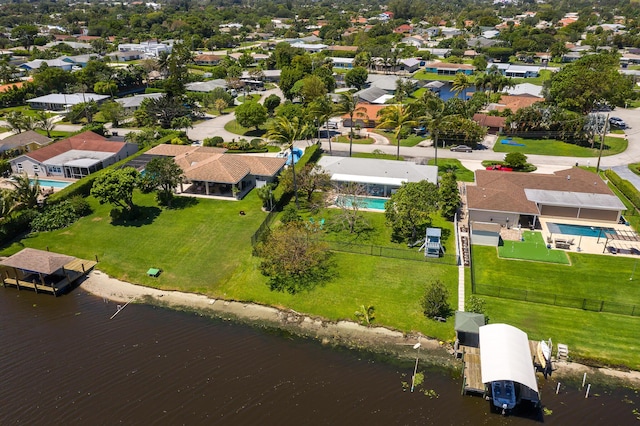 drone / aerial view featuring a residential view and a water view