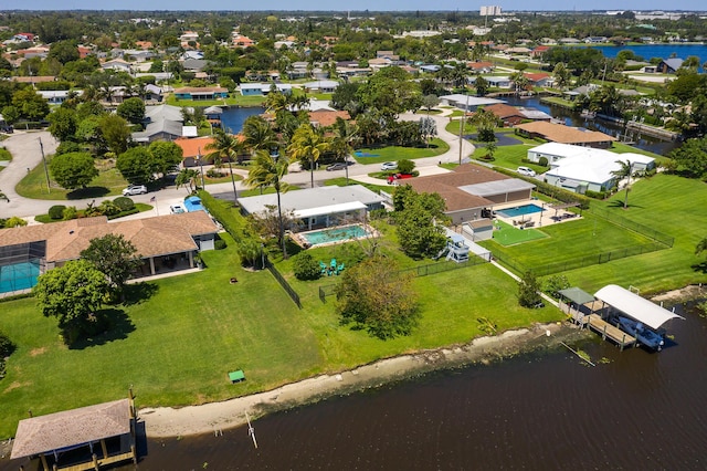 bird's eye view with a water view and a residential view