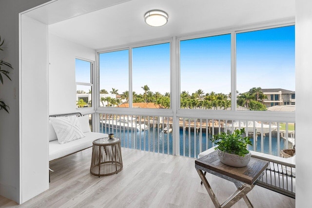 sunroom / solarium with a water view