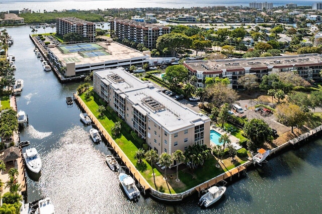 drone / aerial view featuring a water view and a city view