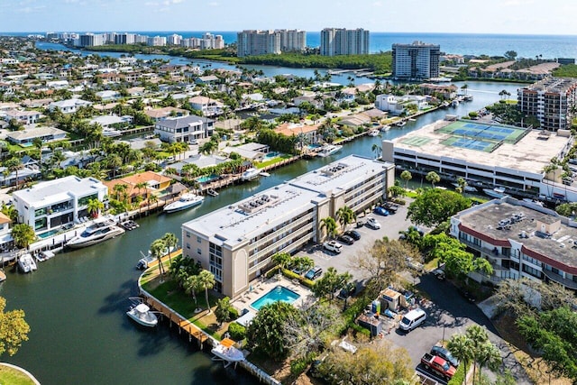 drone / aerial view featuring a water view and a city view