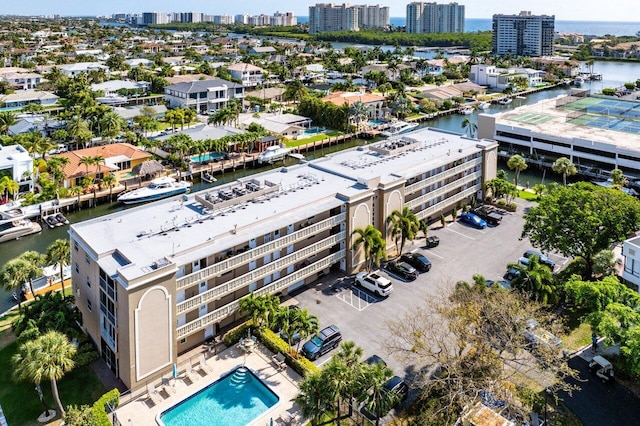 birds eye view of property featuring a view of city and a water view