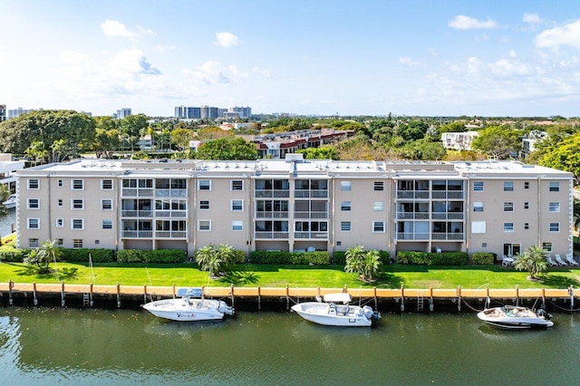 birds eye view of property with a water view