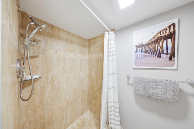 bathroom with a tile shower