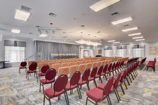 miscellaneous room with visible vents and light carpet