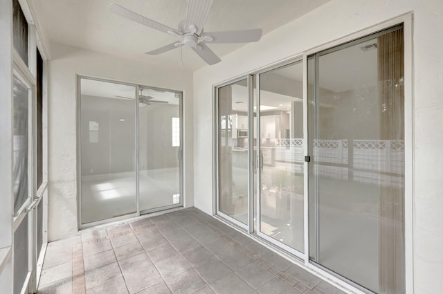 exterior space with a ceiling fan