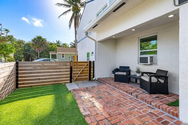view of yard with a patio area, fence, and a gate