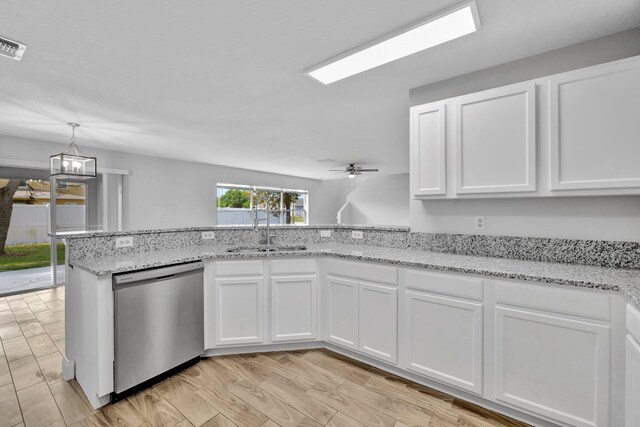 698 SW Mchole Ave, Port Saint Lucie, FL 34953 - kitchen featuring light stone counters, dishwasher, a sink, white cabinetry, and ceiling fan with notable chandelier