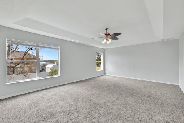 698 SW Mchole Ave, Port Saint Lucie, FL 34953 - unfurnished room featuring ceiling fan, carpet floors, a raised ceiling, baseboards, and visible vents