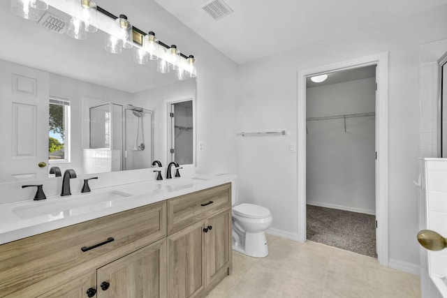 698 SW Mchole Ave, Port Saint Lucie, FL 34953 - bathroom with a spacious closet, visible vents, a sink, and a stall shower