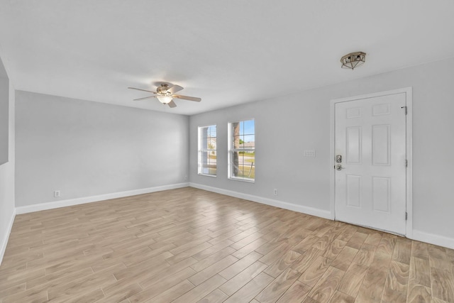 698 SW Mchole Ave, Port Saint Lucie, FL 34953 - spare room with ceiling fan, baseboards, and light wood finished floors