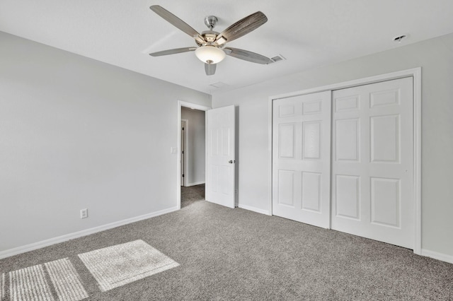 698 SW Mchole Ave, Port Saint Lucie, FL 34953 - unfurnished bedroom featuring visible vents, baseboards, carpet, a closet, and ceiling fan
