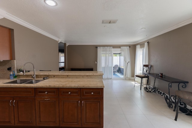 5740 Teakwood Rd, Lake Worth, FL 33467 - kitchen with visible vents, a sink, open floor plan, a peninsula, and light stone countertops