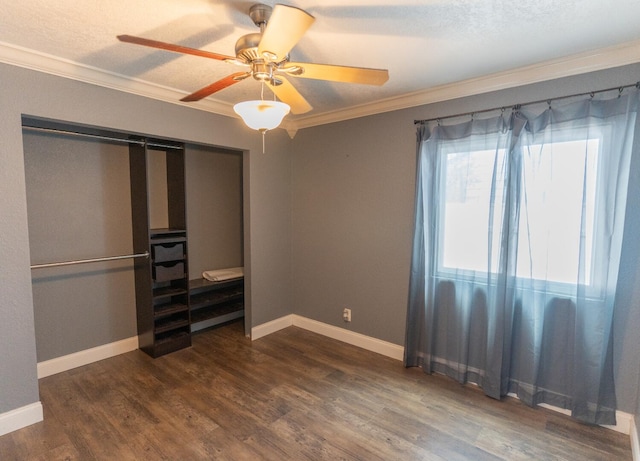 5740 Teakwood Rd, Lake Worth, FL 33467 - unfurnished bedroom featuring dark wood-style floors, a ceiling fan, ornamental molding, and baseboards