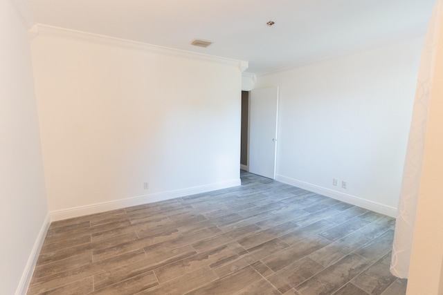 5740 Teakwood Rd, Lake Worth, FL 33467 - spare room featuring ornamental molding, baseboards, wood finished floors, and visible vents