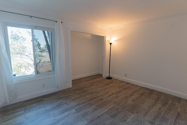 5740 Teakwood Rd, Lake Worth, FL 33467 - empty room featuring ornamental molding, a healthy amount of sunlight, baseboards, and dark wood finished floors