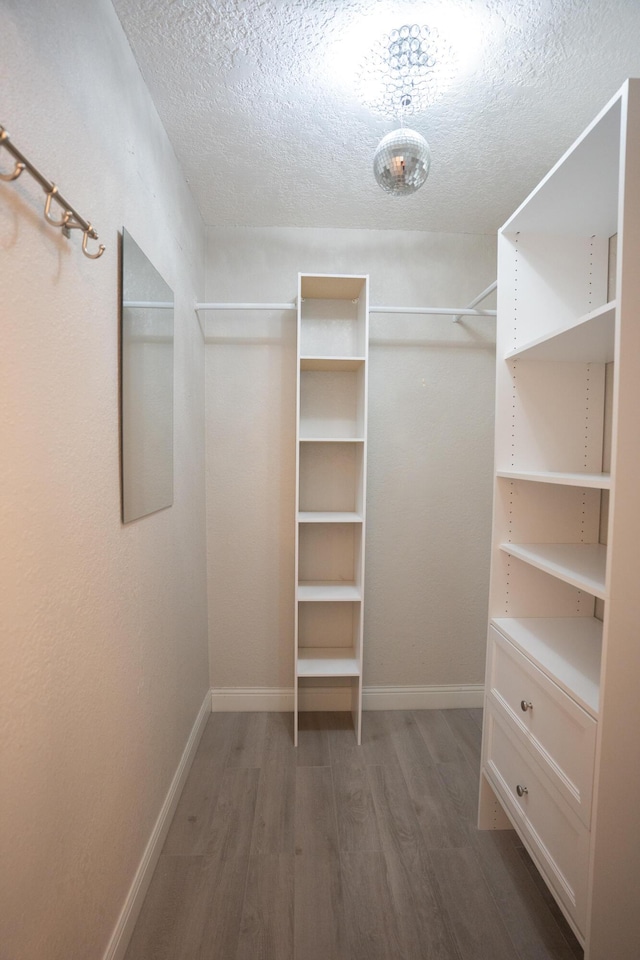 5740 Teakwood Rd, Lake Worth, FL 33467 - spacious closet featuring wood finished floors