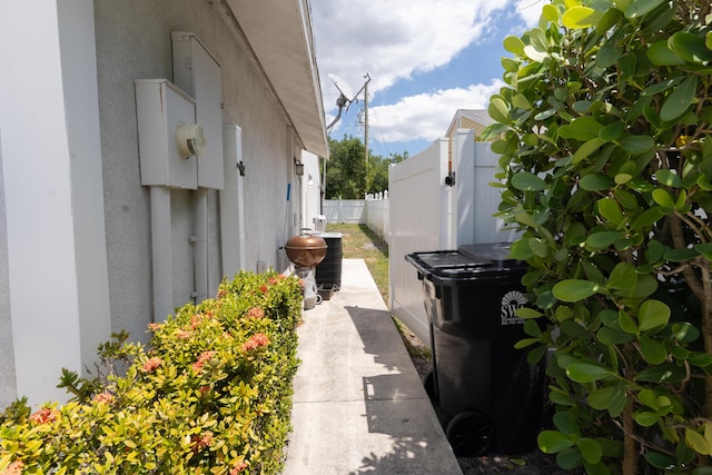 5740 Teakwood Rd, Lake Worth, FL 33467 - view of side of home with stucco siding and fence