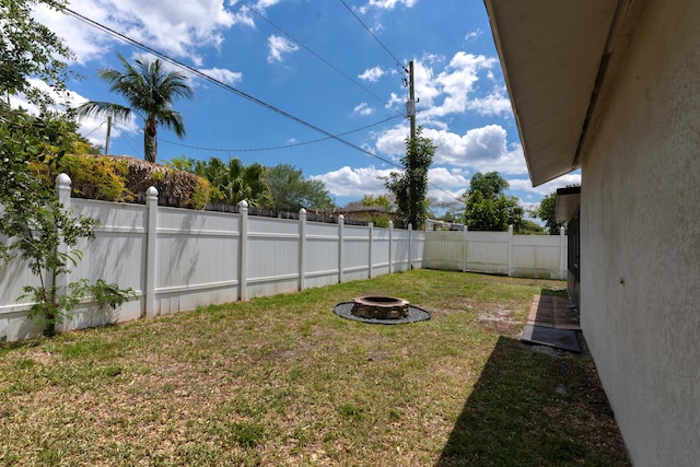 5740 Teakwood Rd, Lake Worth, FL 33467 - view of yard with an outdoor fire pit and a fenced backyard