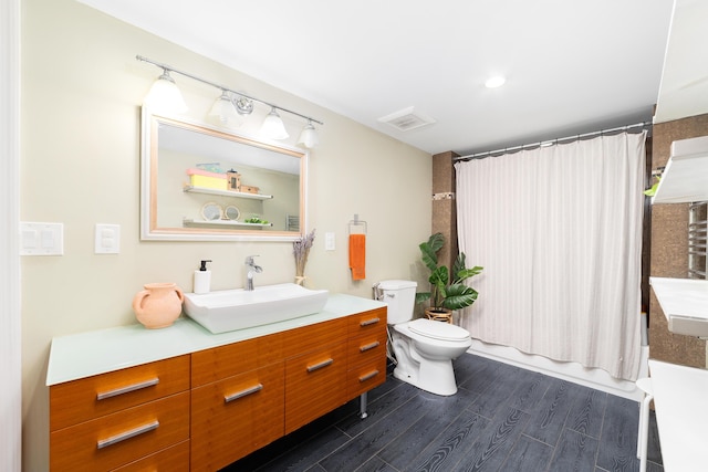 2869 SW 13th Ct, Fort Lauderdale, FL 33312 - bathroom featuring vanity, toilet, and wood finished floors