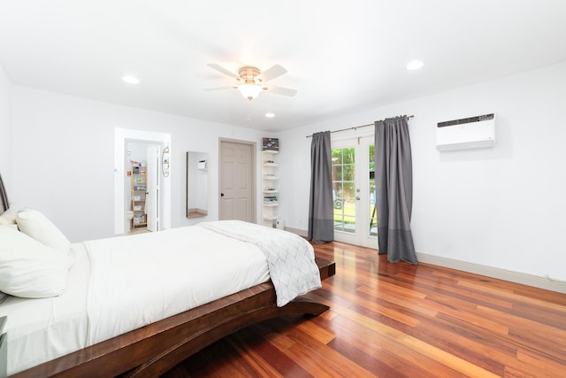 2869 SW 13th Ct, Fort Lauderdale, FL 33312 - bedroom featuring a wall unit AC, access to outside, wood finished floors, a ceiling fan, and baseboards