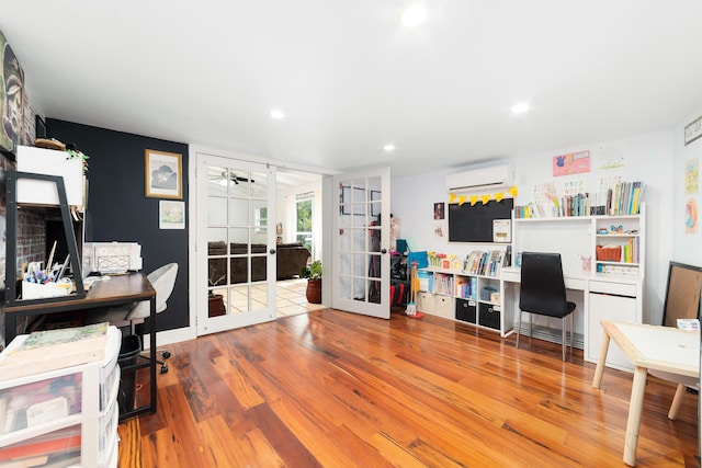 2869 SW 13th Ct, Fort Lauderdale, FL 33312 - office space with french doors, ceiling fan, a wall mounted AC, wood finished floors, and recessed lighting