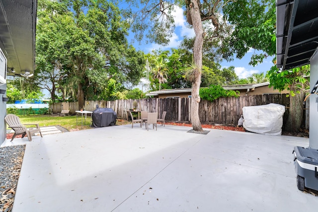 2869 SW 13th Ct, Fort Lauderdale, FL 33312 - fenced backyard featuring area for grilling and a patio