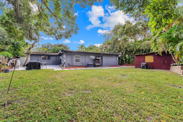 2869 SW 13th Ct, Fort Lauderdale, FL 33312 - rear view of property featuring a patio area, central AC, and an AC wall unit