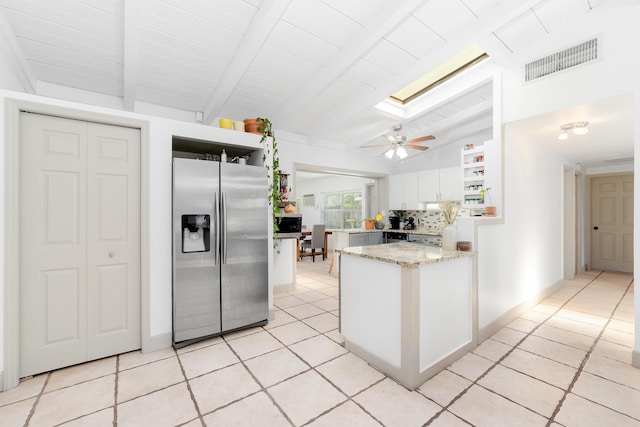 2869 SW 13th Ct, Fort Lauderdale, FL 33312 - kitchen with stainless steel fridge with ice dispenser, a peninsula, white cabinetry, light tile patterned floors, and a ceiling fan