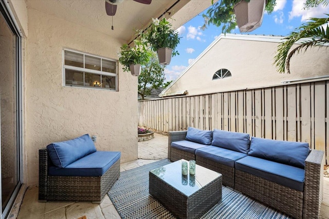 view of patio featuring a fenced backyard, ceiling fan, and outdoor lounge area