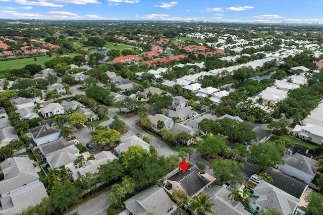 birds eye view of property featuring a water view and a residential view