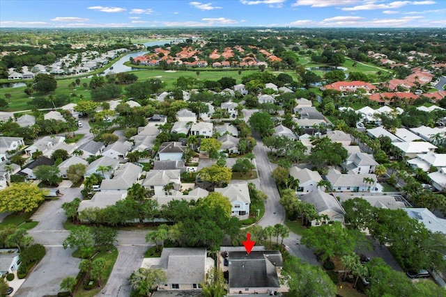 birds eye view of property featuring a residential view, view of golf course, and a water view
