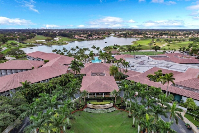 bird's eye view with a water view and golf course view