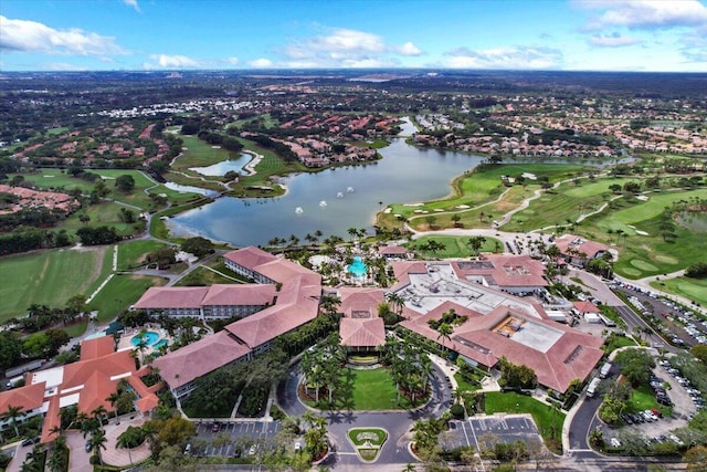 birds eye view of property featuring a water view, a residential view, and view of golf course