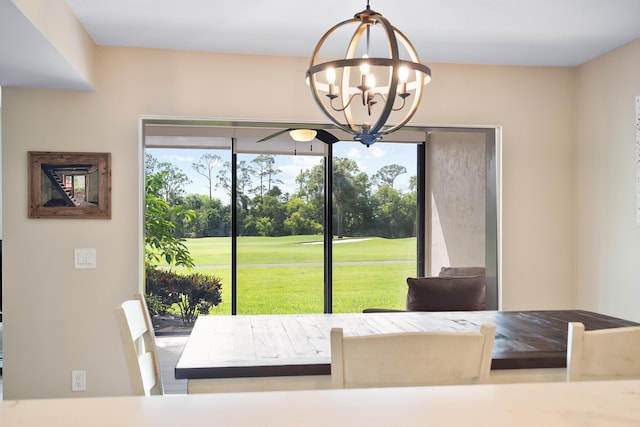 5657 SE Foxcross Pl, Stuart, FL 34997 - dining room featuring a chandelier and golf course view