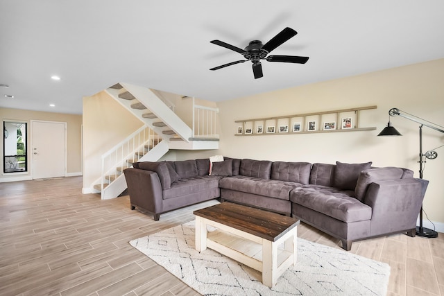 5657 SE Foxcross Pl, Stuart, FL 34997 - living area featuring stairs, light wood-style floors, a ceiling fan, baseboards, and recessed lighting