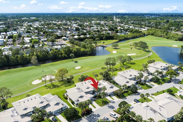 5657 SE Foxcross Pl, Stuart, FL 34997 - aerial perspective of suburban area featuring a nearby body of water and a local golf course