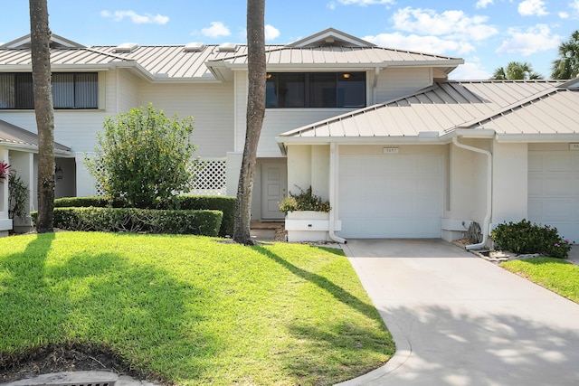 5657 SE Foxcross Pl, Stuart, FL 34997 - multi unit property featuring a standing seam roof, metal roof, concrete driveway, and a front yard