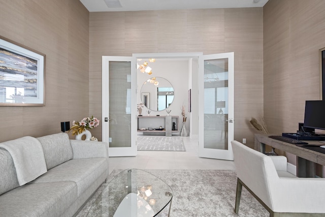 tiled living area featuring french doors
