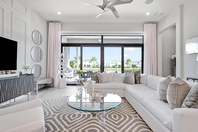 living area with ceiling fan, recessed lighting, and light tile patterned flooring