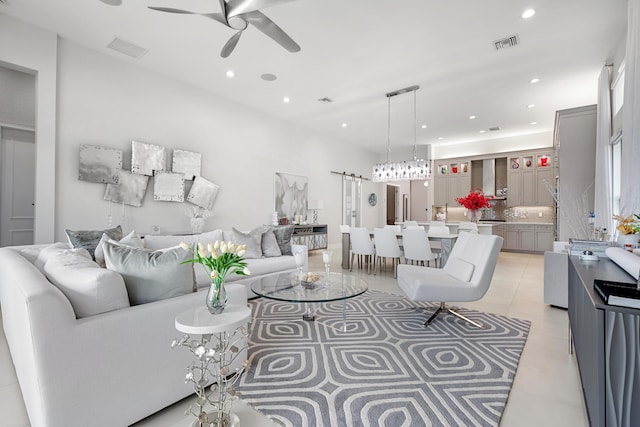 living area with light tile patterned floors, ceiling fan, visible vents, and recessed lighting
