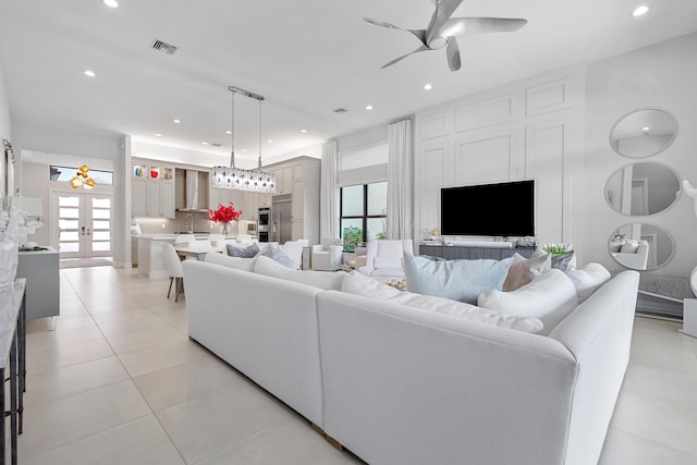 living room featuring a wealth of natural light, a ceiling fan, light tile patterned flooring, and recessed lighting