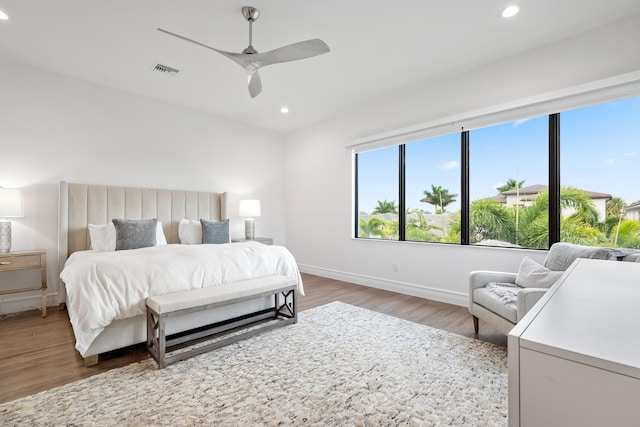 bedroom with baseboards, recessed lighting, visible vents, ceiling fan, and light wood finished floors