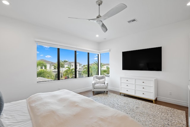 bedroom with ceiling fan, visible vents, recessed lighting, wood finished floors, and baseboards