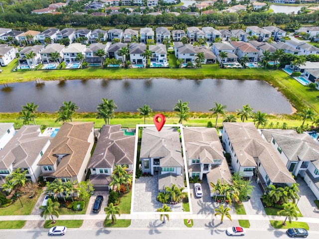 aerial view featuring a water view and a residential view