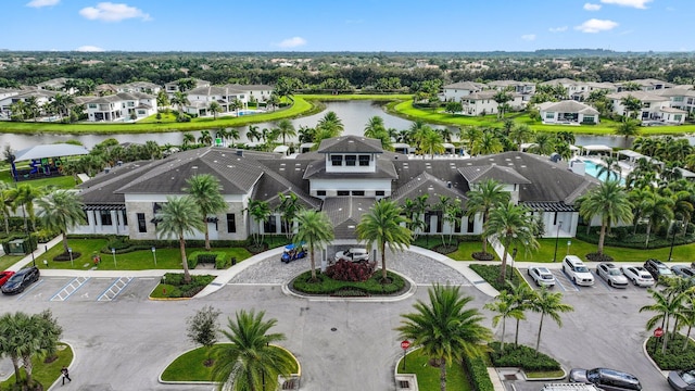 bird's eye view featuring a water view and a residential view